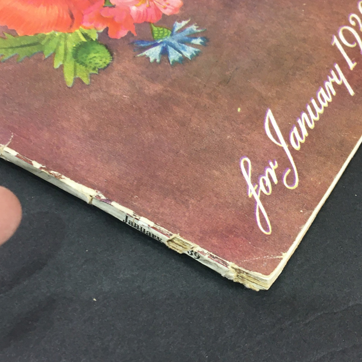 Close-up of the spine of 'The American Home for 1939 Vol XXL #2' showing the publication date for January 1939 with visible wear.