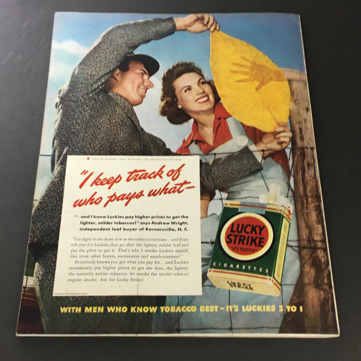 Back cover of the VTG The American Home July 1941 magazine featuring a vintage advertisement for Lucky Strike cigarettes with two cheerful models, reflecting the advertising style of the 1940s.