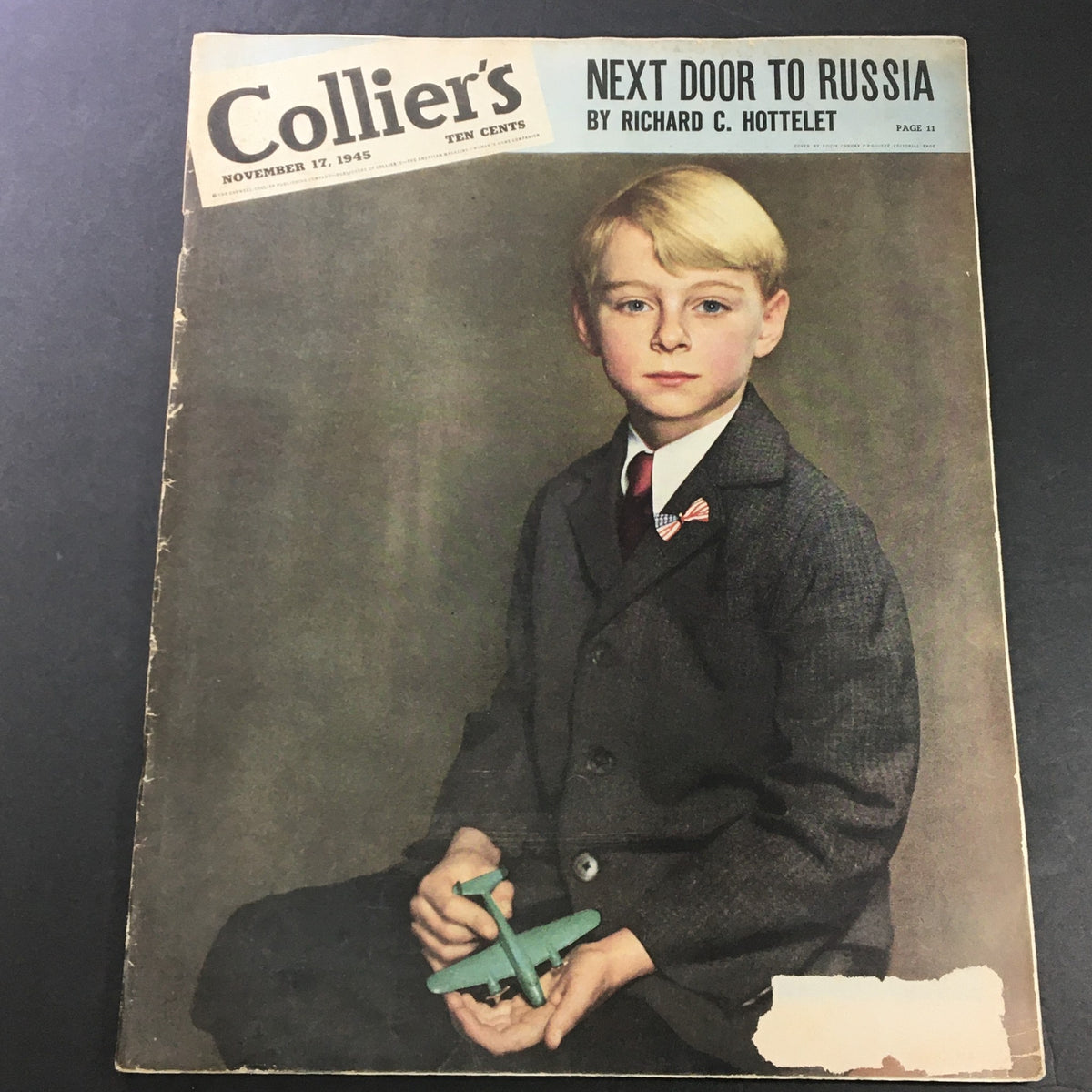 Cover of VTG Collier's Magazine November 17 1945 featuring the article 'Next Door to Russia' by Richard C. Hottelet, showcasing a young boy with a toy airplane.