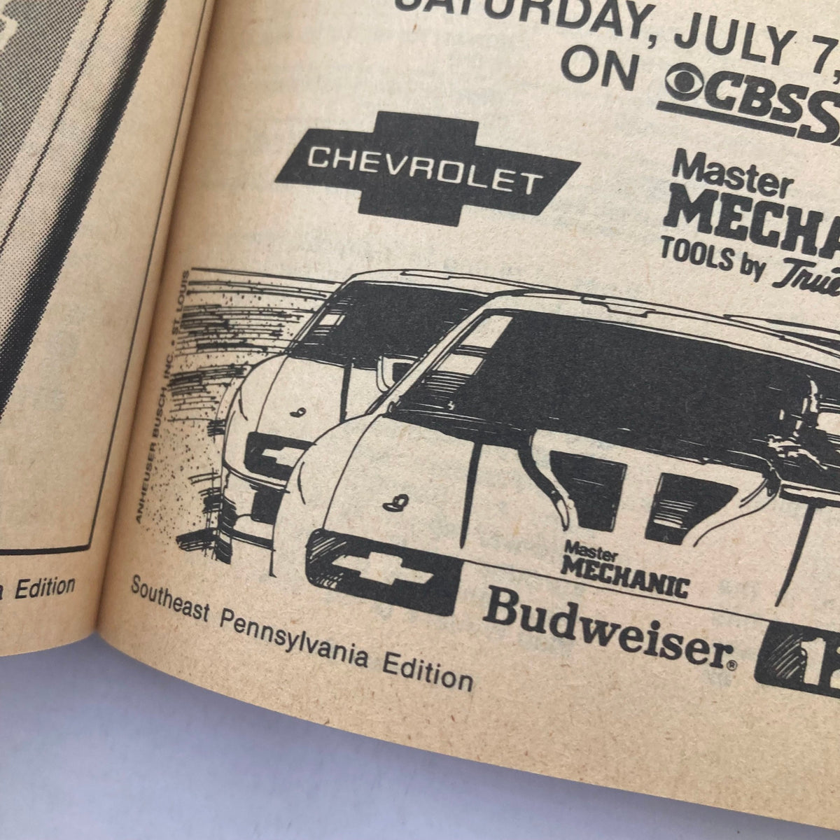 Illustration from TV Guide Magazine July 7 1984 featuring Chevrolet and Master Mechanic tools advertisement. This Southeast Pennsylvania Edition highlights classic automotive themes, showcasing iconic cars and branding in a vintage style.