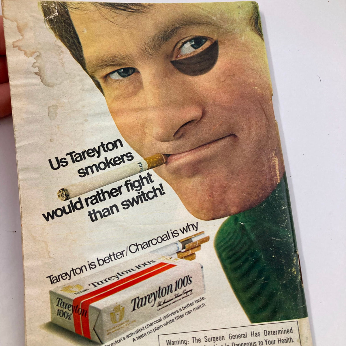 Advertising page in TV Guide Magazine June 23 1973 #556 promoting Tareyton cigarettes with a slogan about loyalty among smokers and featuring a man with a cigarette.