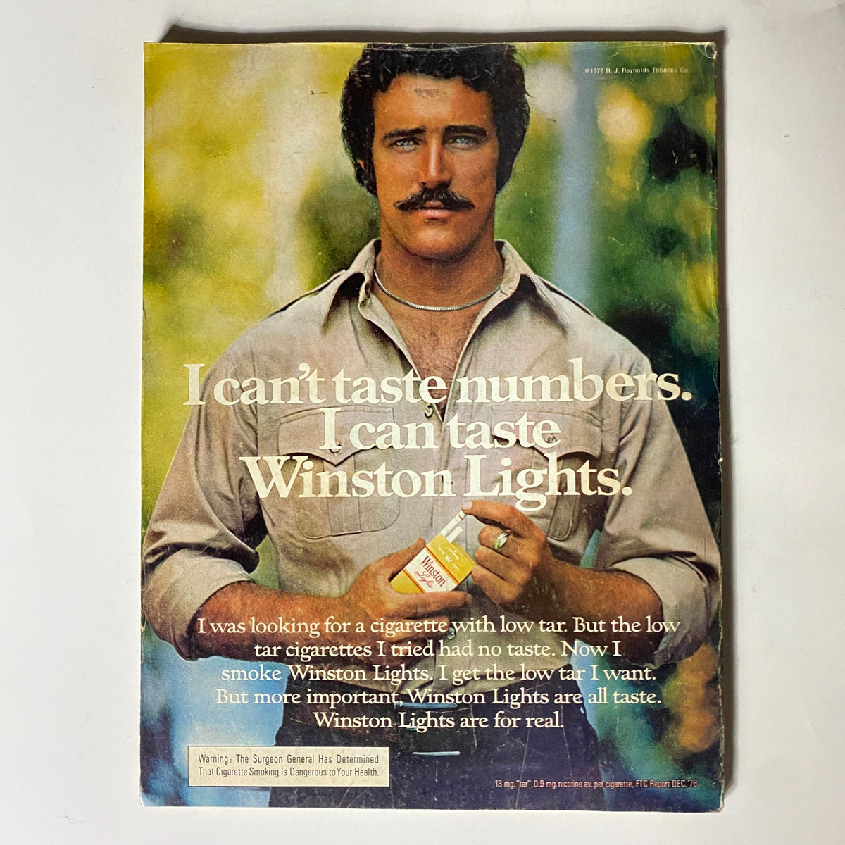 Advertisement in VTG Popular Science Magazine July 1977 featuring Winston Lights cigarettes with a man stating, 'I can’t taste numbers. I can taste Winston Lights.'