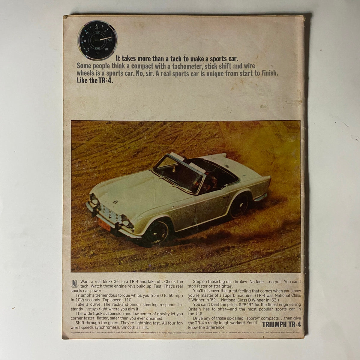 Back cover of Car and Driver Magazine February 1964 featuring an advertisement for the Triumph TR-4 sports car with a promotional message.