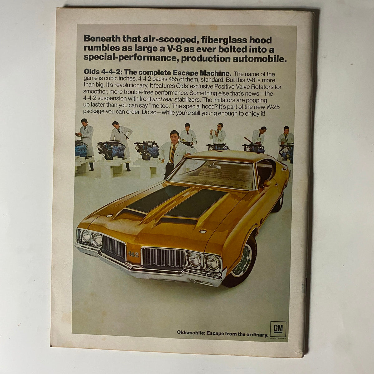 Back cover of a vintage Car and Driver Magazine showcasing an Olds 4-4-2 with detailed performance features and sales information.
