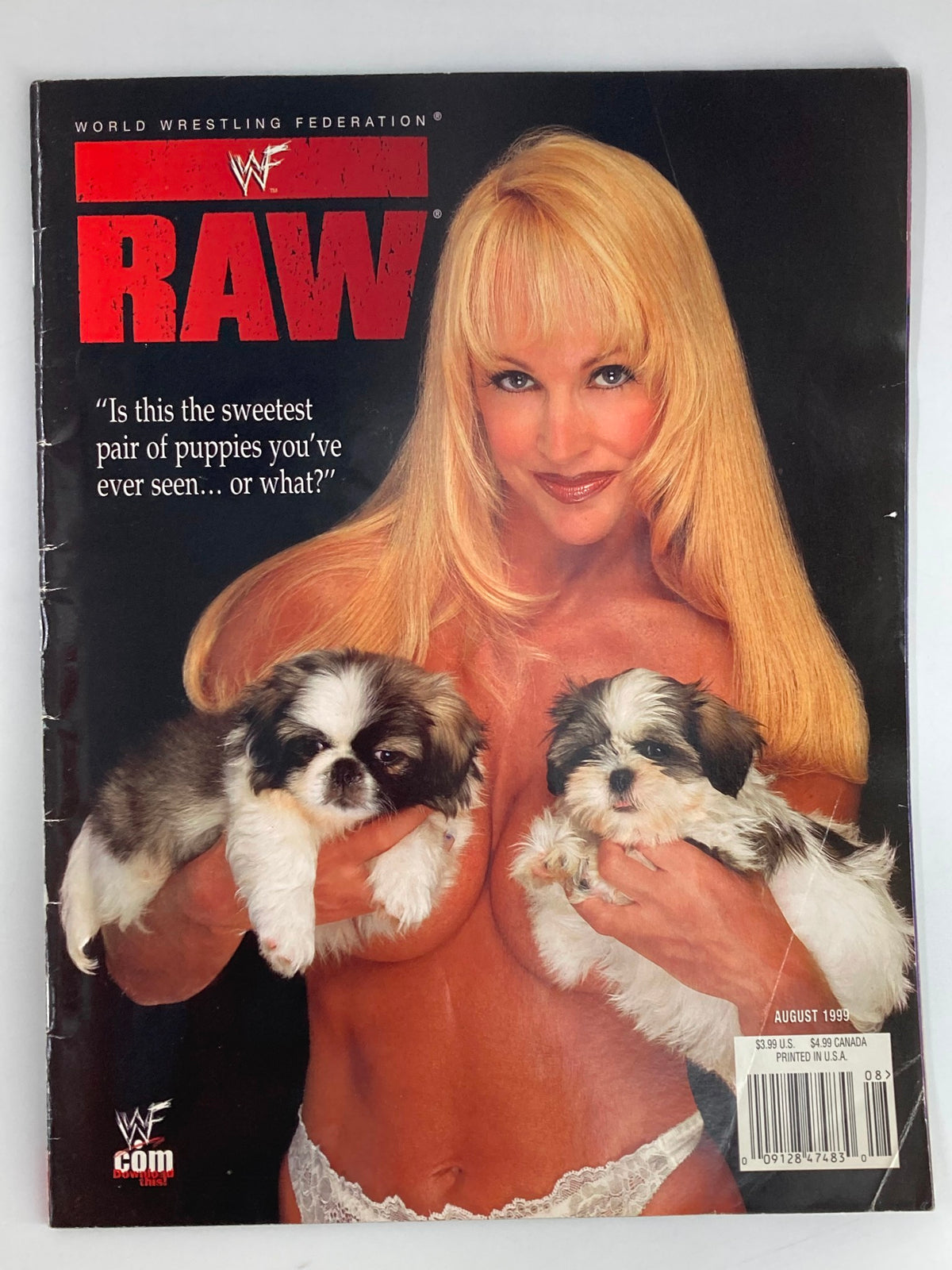 WWF Raw Magazine August 1999 featuring Debra Marshall holding two puppies on the cover.