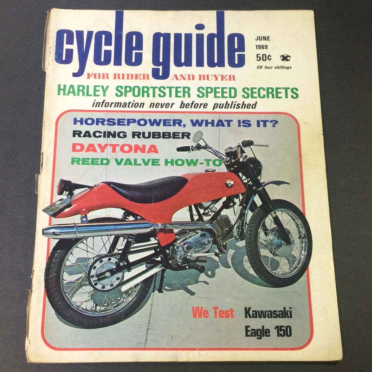 Cover of the 'VTG Cycle Guide For Rider and Buyer June 1969' featuring a Kawasaki Eagle 150 motorcycle, highlighting a road test with colorful text and vintage design.
