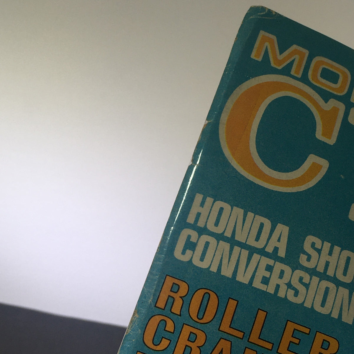 Close-up view of the VTG Modern Cycle Magazine from May 1969 featuring bold text on Honda Shock Conversion and Roller Craft, showcasing its vintage design and condition.