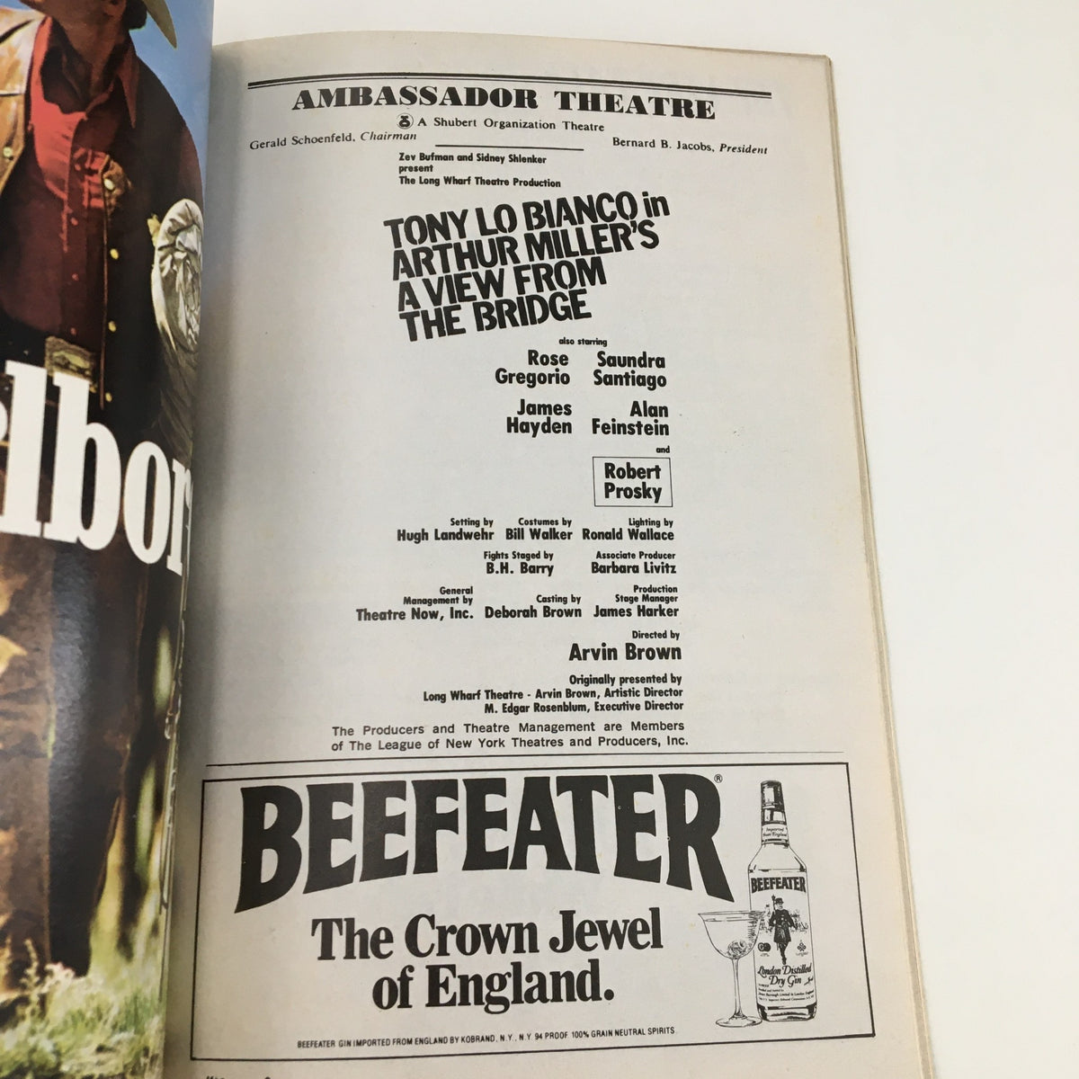 Ambassador Theatre Playbill featuring Tony Lo Bianco in Arthur Miller's A View From The Bridge, showcasing the cast and production details.