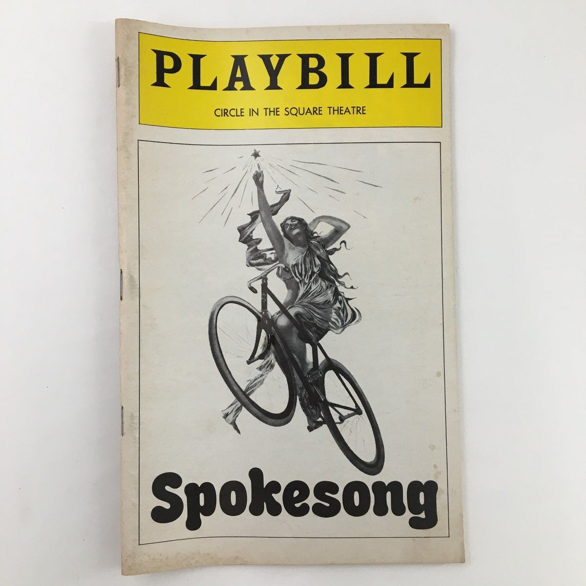 1979 Playbill for John Horton in Spokesong featuring a woman on a bicycle, produced by Circle in the Square Theatre.