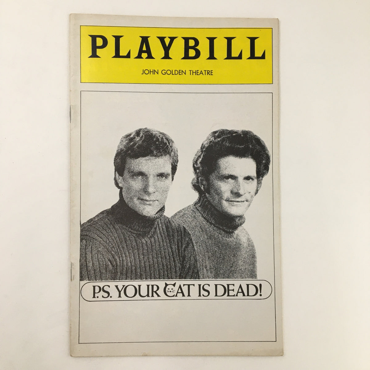 Front cover of the 1975 Playbill for 'P.S. Your Cat is Dead' at the John Golden Theatre, featuring two male performers.