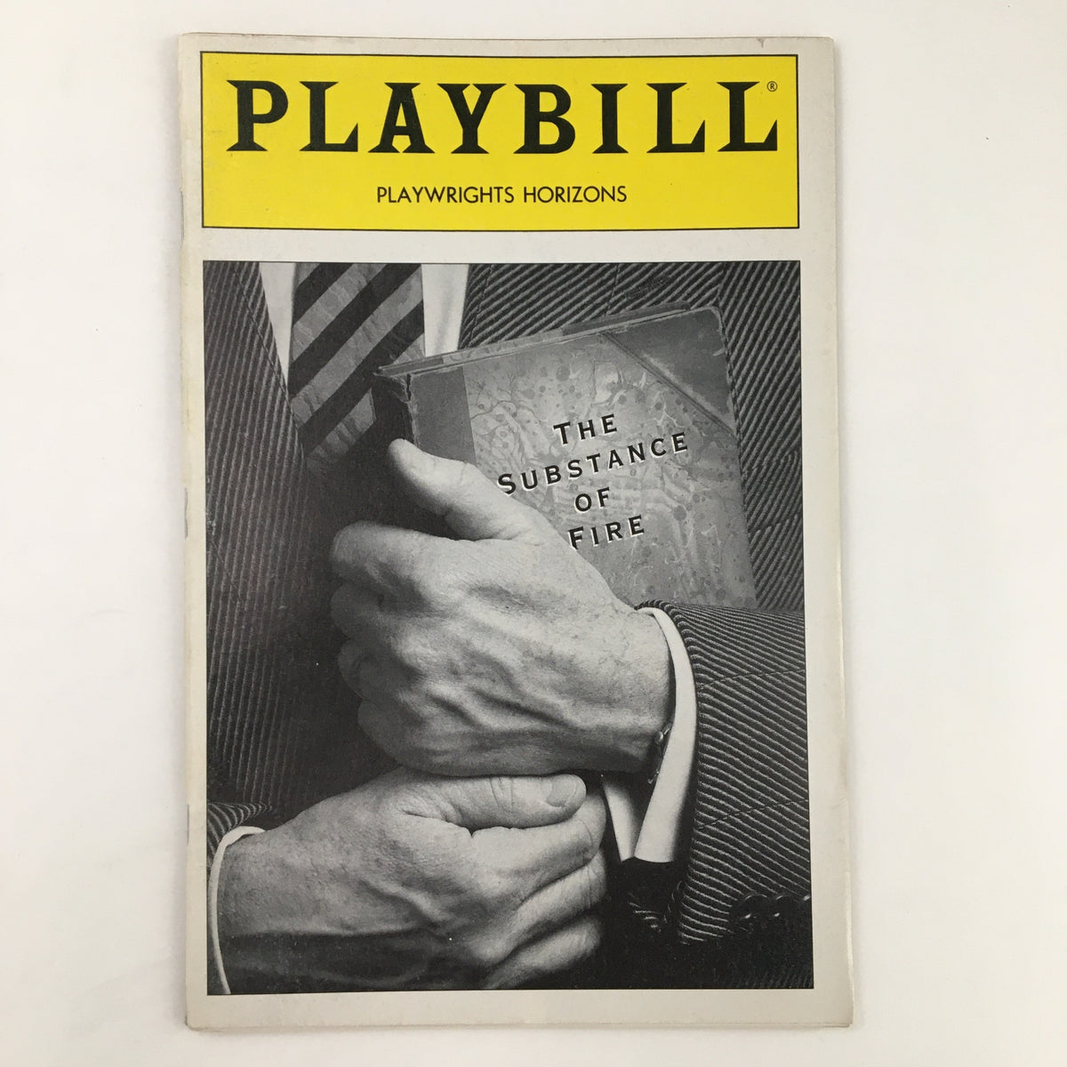 1991 Playbill for The Substance of Fire by Jon Robin Baitz featuring a black and white image of hands holding the play's script, presented by Playwright Horizons.