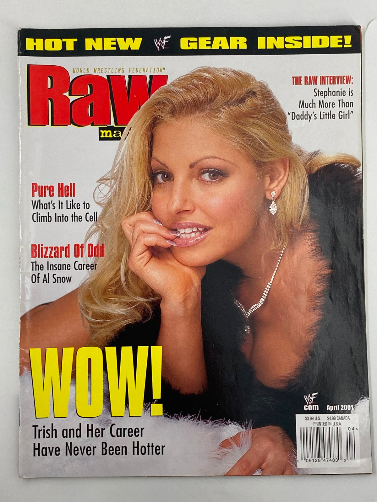 WWF Raw Magazine April 2001 featuring Trish Stratus on the cover, highlighting her career with bold 'WOW!' text and a captivating image of Trish.