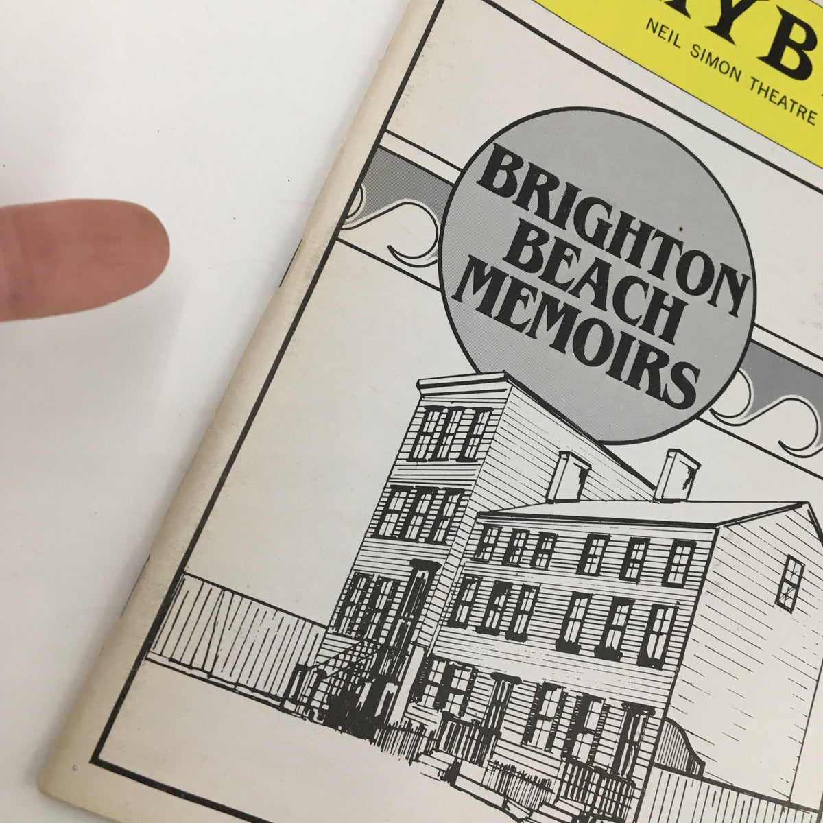 Close-up view of the 1983 Playbill for Brighton Beach Memoirs highlighting the title and the play's unique cover art.