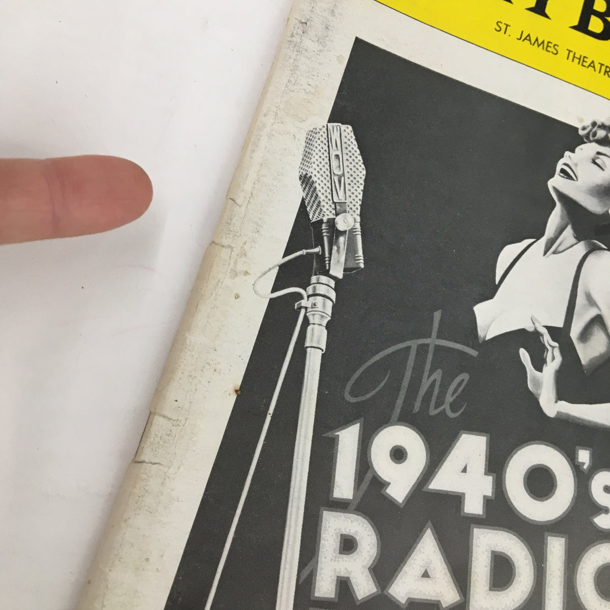 Close-up of the 1979 Playbill for The 1940s Radio Hour showcasing the cover details with a hand pointing to a microphone.