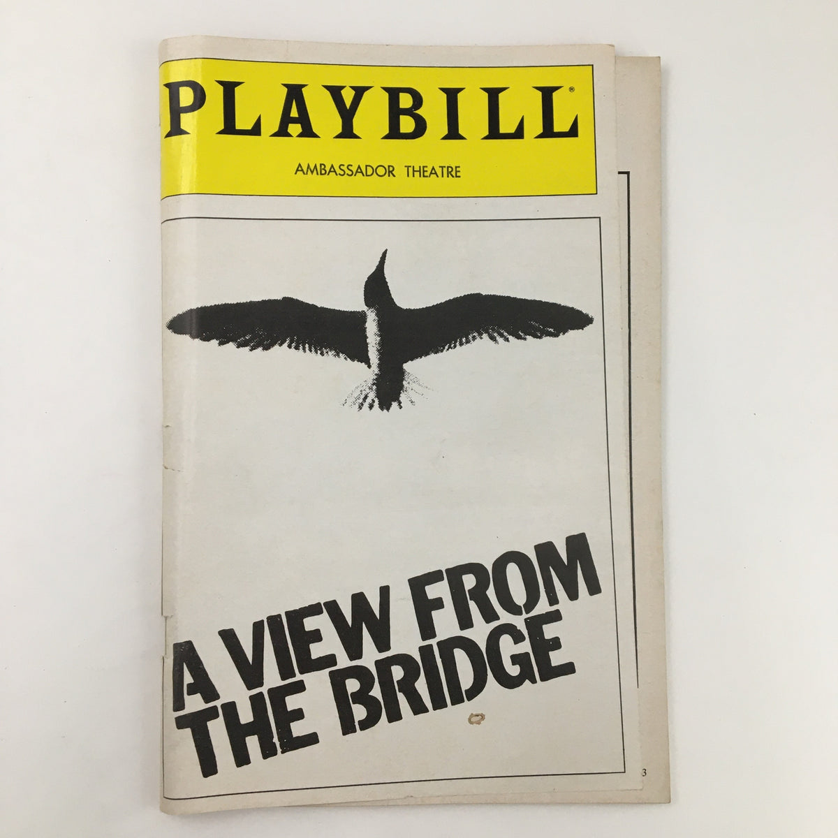 1983 Playbill for Arthur Miller's A View From The Bridge, featuring a design with a bird silhouette on the cover from the Ambassador Theatre.