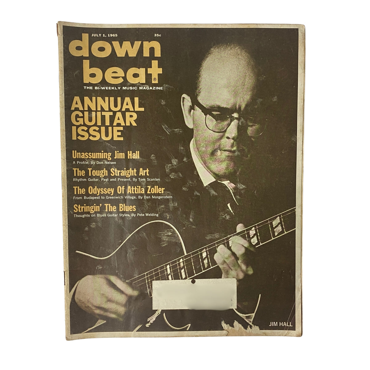 Cover of Down Beat Magazine July 1, 1965 Vol 32 No 19 featuring guitarist Jim Hall, highlighting the articles 'Unassuming Jim Hall,' 'The Tough Straight Art,' and 'The Odyssey of Attila Zoller.' This vintage magazine showcases jazz music culture.