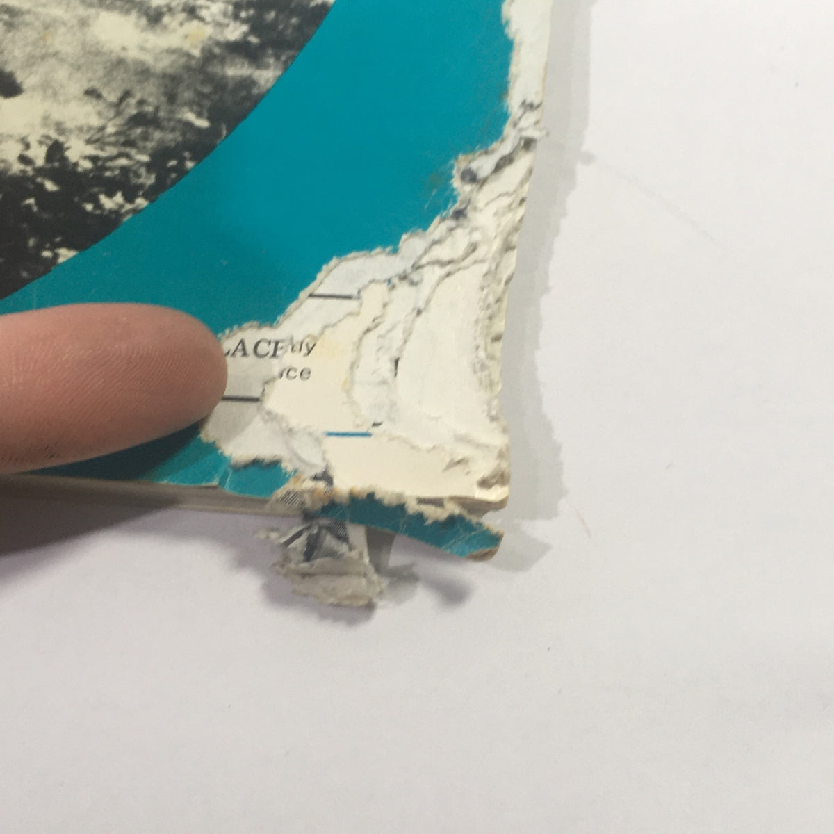 Close-up of the damaged corner of VTG Cycle Sport Magazine September 1967, highlighting wear and minor rips, displaying its vintage condition.