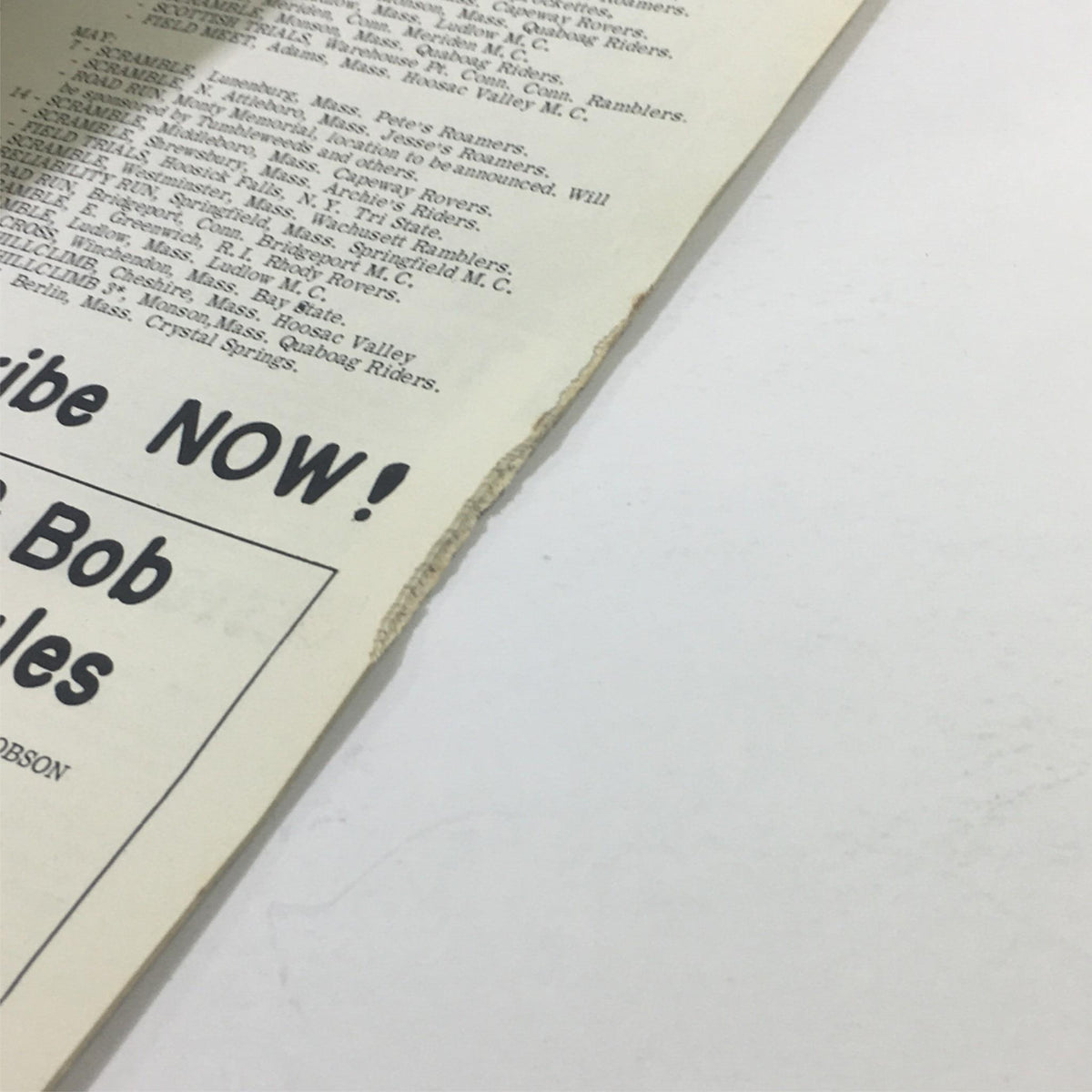 Close-up detail of the VTG Cycle Sport Magazine March 1961, showcasing edge wear and vintage advertisement. Perfect for collectors interested in cycling history.