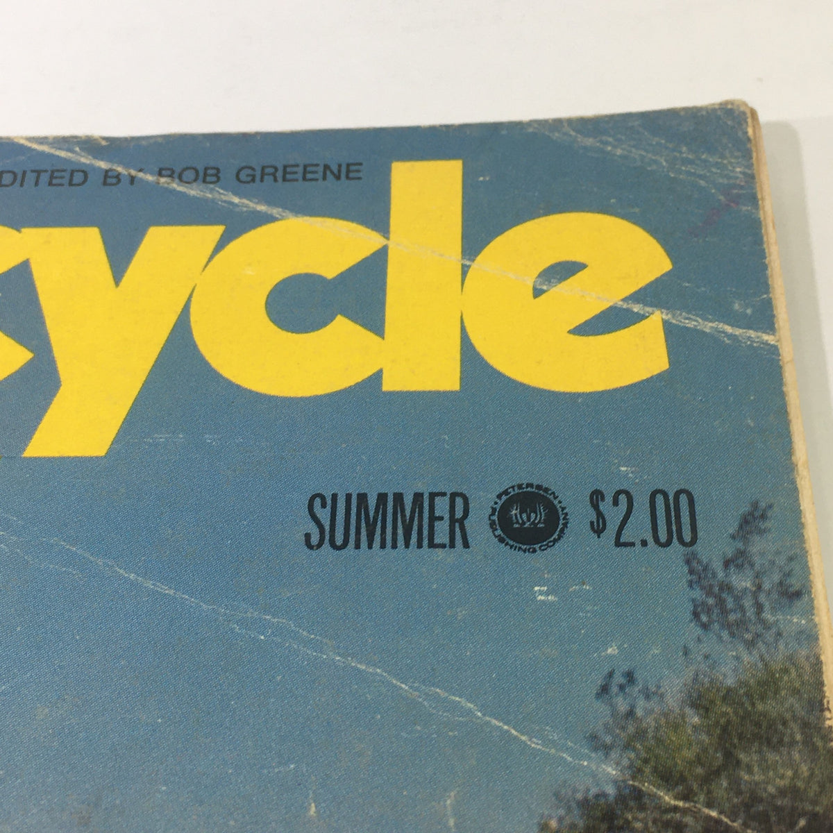 Close-up view of the VTG Motorcycle Sport Quarterly Magazine Summer 1971 title, highlighting the vibrant yellow text and summer edition details.