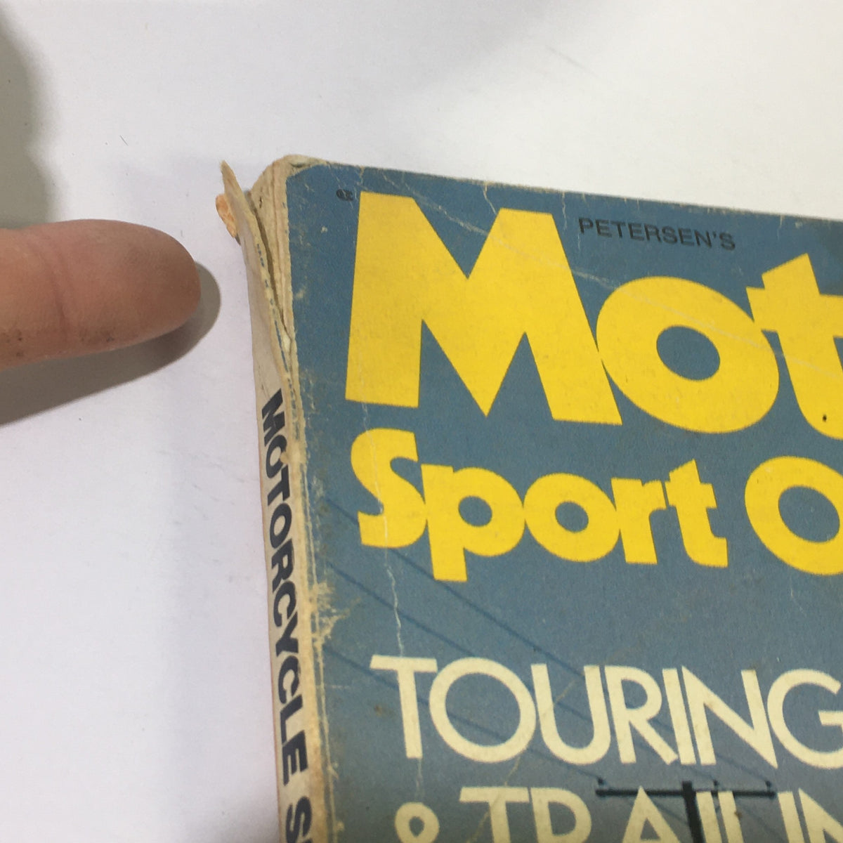 Side view of the VTG Motorcycle Sport Quarterly Magazine Summer 1971, showcasing the spine and the magazine cover with key title elements.