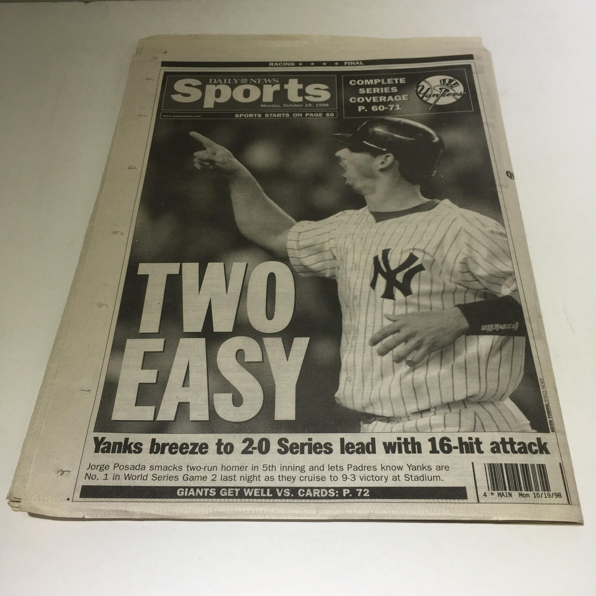 NY Daily News October 19, 1998 cover showing New York Yankees player celebrating with the headline 'TWO EASY' highlighting Yankees' victory and performance in World Series.