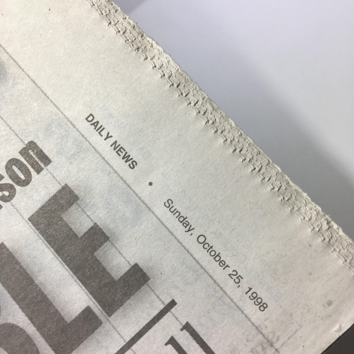 Close-up of the top edge of the NY Daily News dated Sunday, October 25, 1998, highlighting the publication details related to the 'Perfect Game, Series Sweep, 125-Win Season' issue.