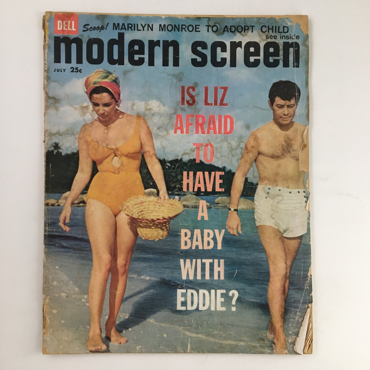 Modern Screen Magazine July 1960 featuring Elizabeth Taylor in a swimsuit on the beach with Eddie Fisher in the background, exploring Hollywood's vintage charm.
