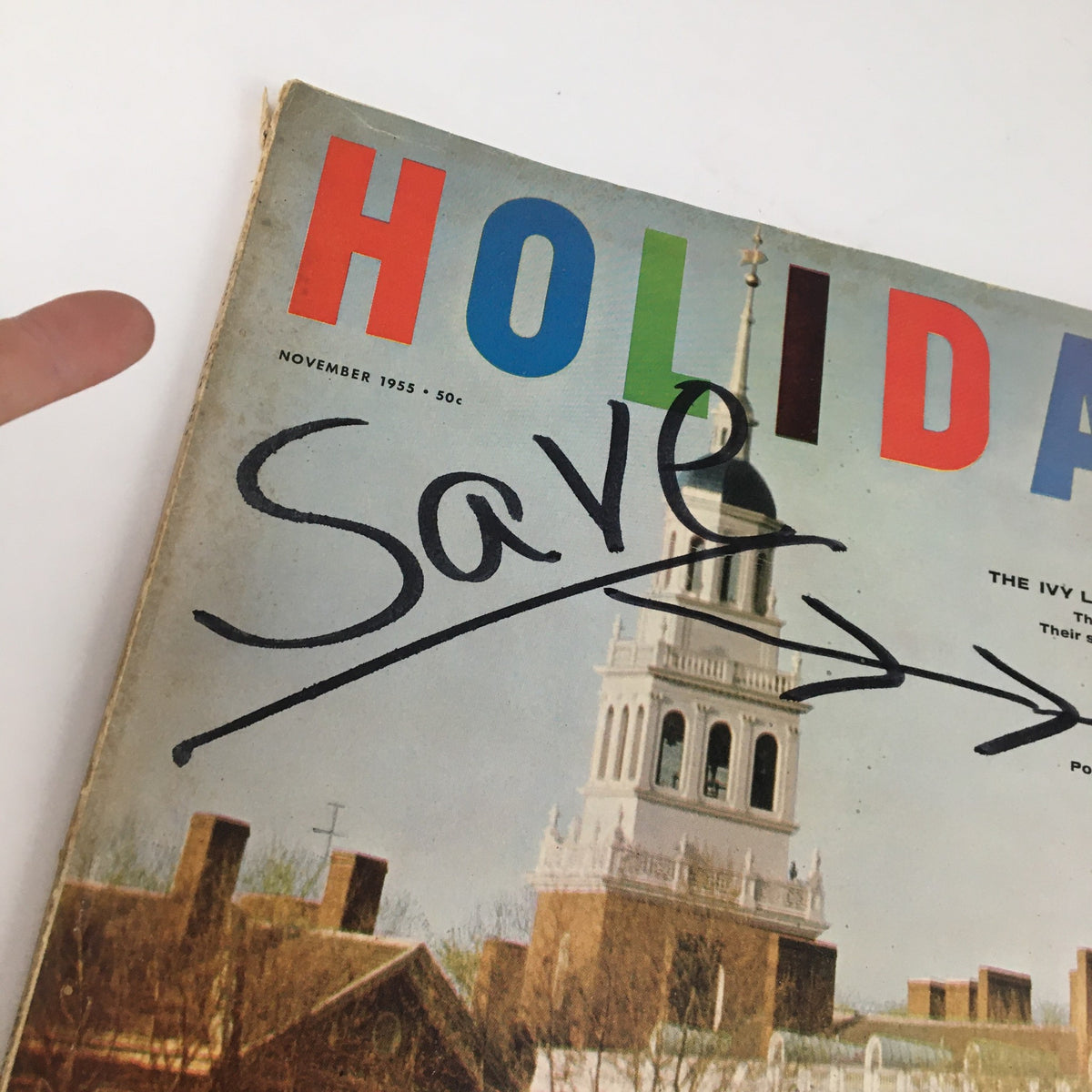 Close-up of Holiday Magazine November 1955 cover showing the title and part of the university image with handwritten text indicating 'Save'.