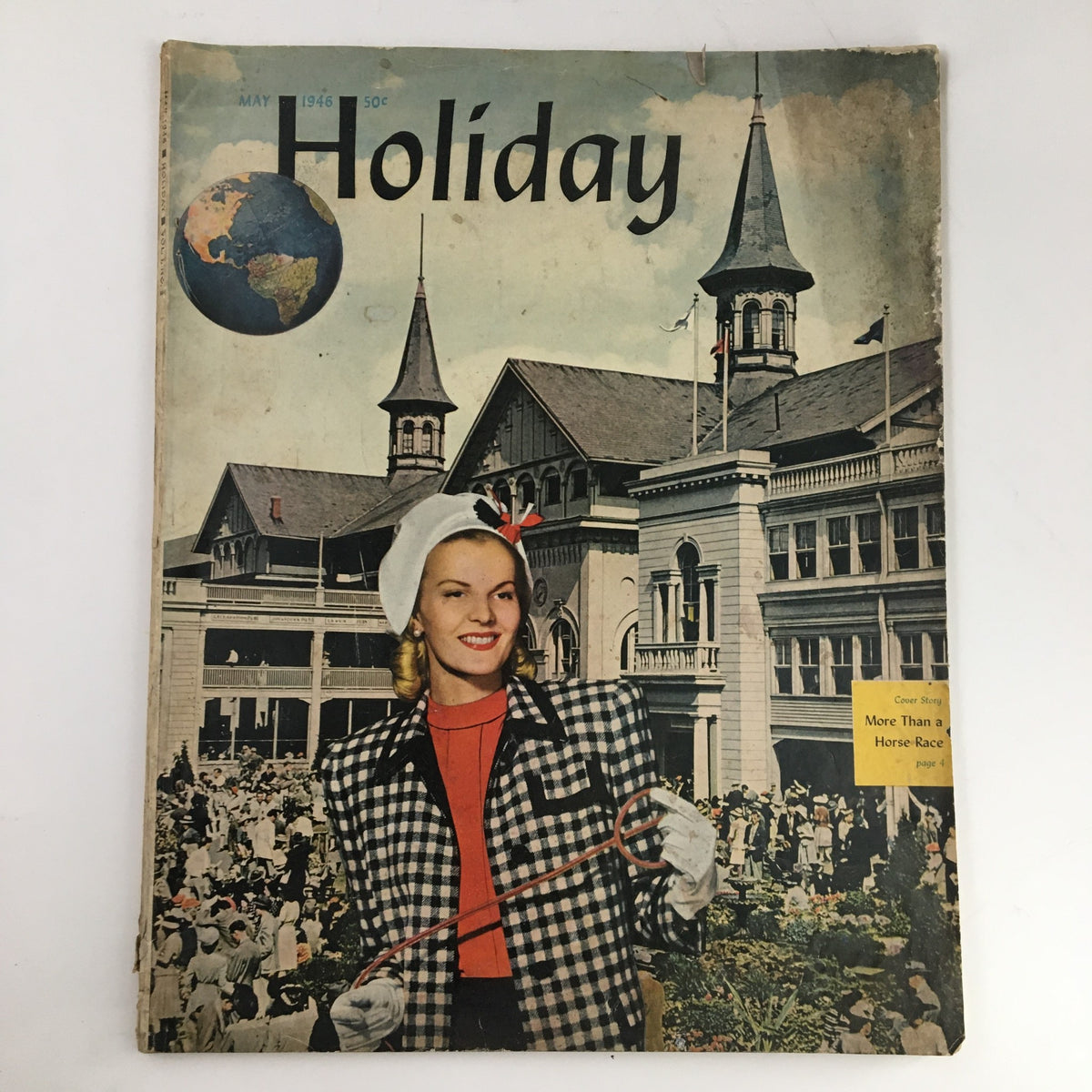 Cover of Holiday Magazine May 1946 featuring a woman in a stylish black and white checkered suit and a white hat, with the Grand Canyon depicted in the background. The magazine highlights the theme 'The Great Walled River at Grand Canyon'.