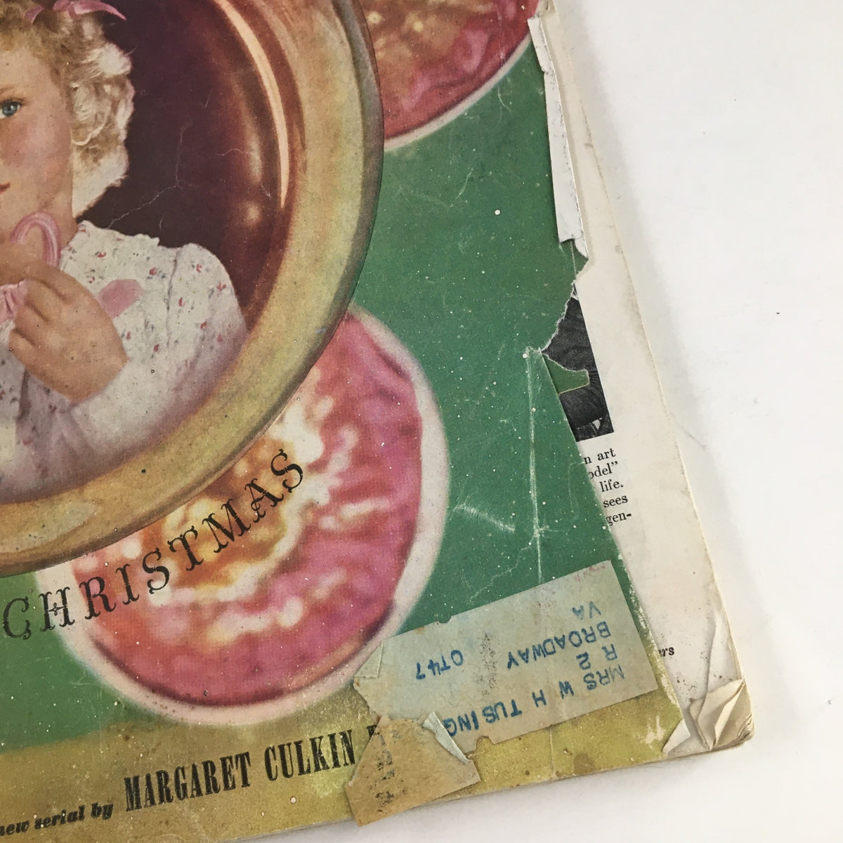 Close-up of the cover of Woman's Home Companion Magazine December 1946 highlighting the words 'Merry Christmas' and the young girl with a candy cane, set against a festive background.