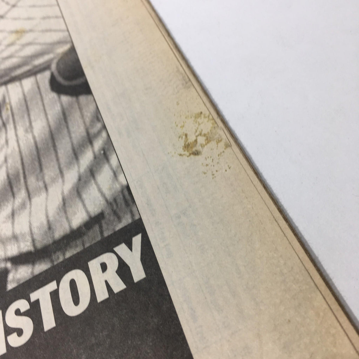 Detail of the NY Daily News newspaper from May 18, 1998, highlighting minor staining along the edge, covering the history-making perfect game by Yankees pitcher David Wells.