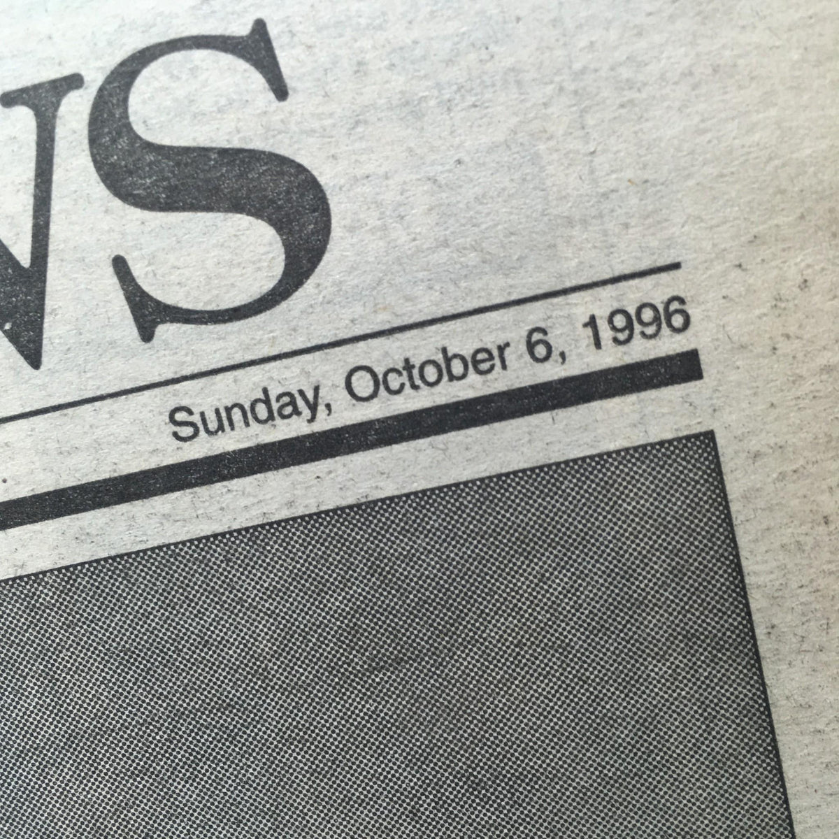 Close-up of the date and title from the NY Daily News vintage magazine, showcasing Sunday, October 6, 1996, headline 'Bring On Da Boids! Yanks Take Out Texas; Orioles Next'.