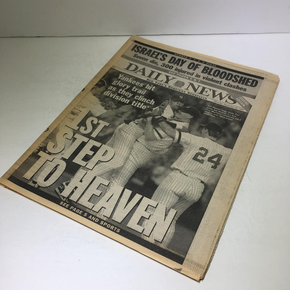 Front page of the New York Daily News from September 26, 1996 showcasing the headline '1st Step to Heaven' related to the Yankees clinching the division title.