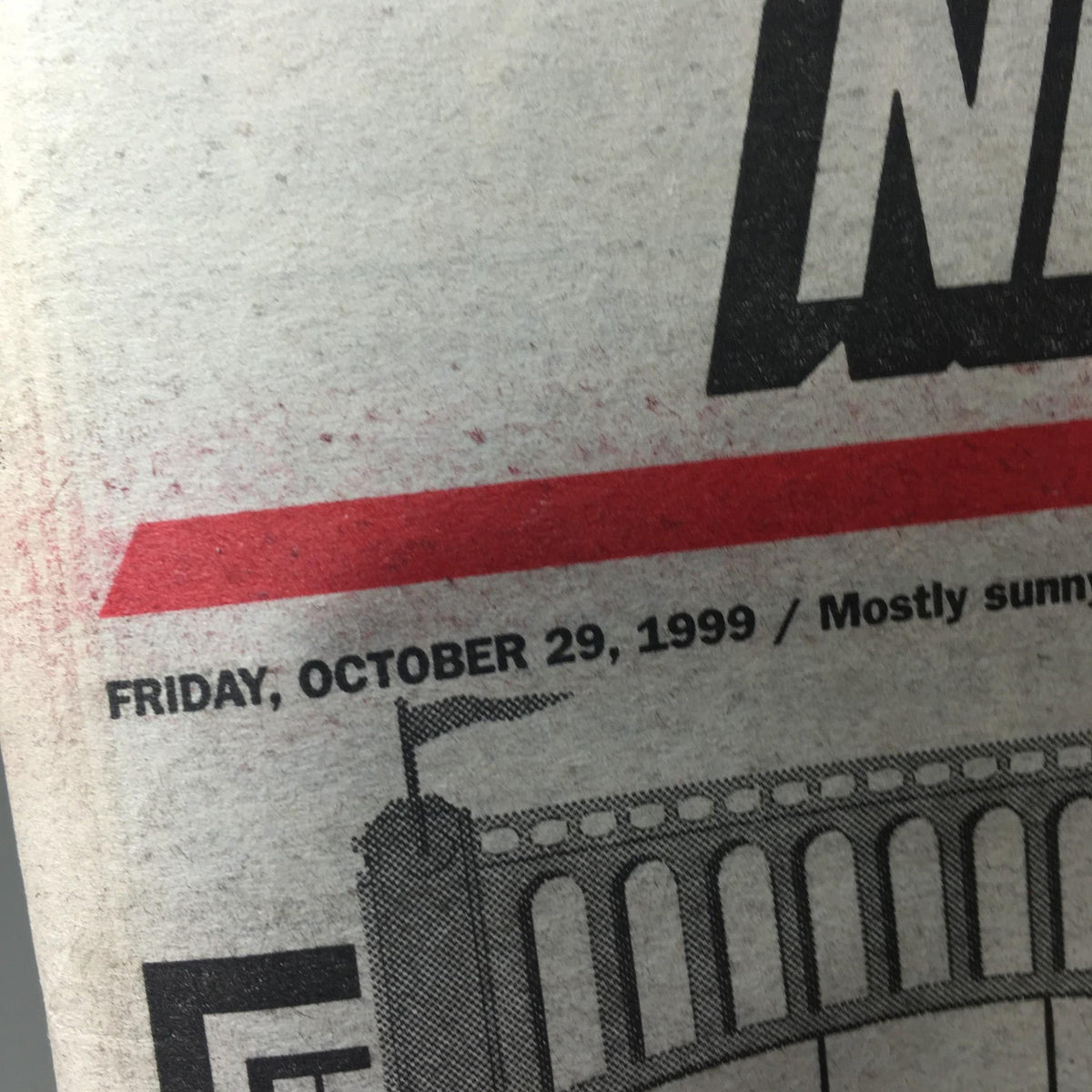 Close-up of New York Post dated Friday, October 29, 1999, showing details of the newspaper including weather and date, part of the Yankee Parade Extra edition.