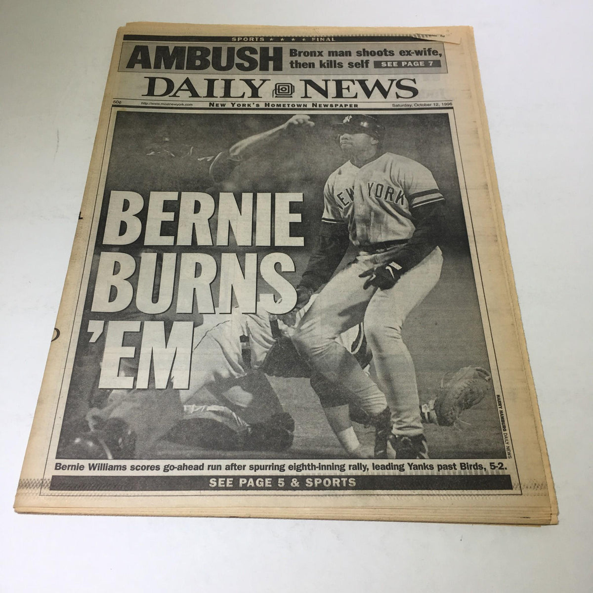 Front page of New York Daily News from October 12, 1996, featuring the headline 'Bernie Burns 'Em'. The article discusses Bernie Williams scoring the go-ahead run, leading the Yankees to a victory over the Orioles.