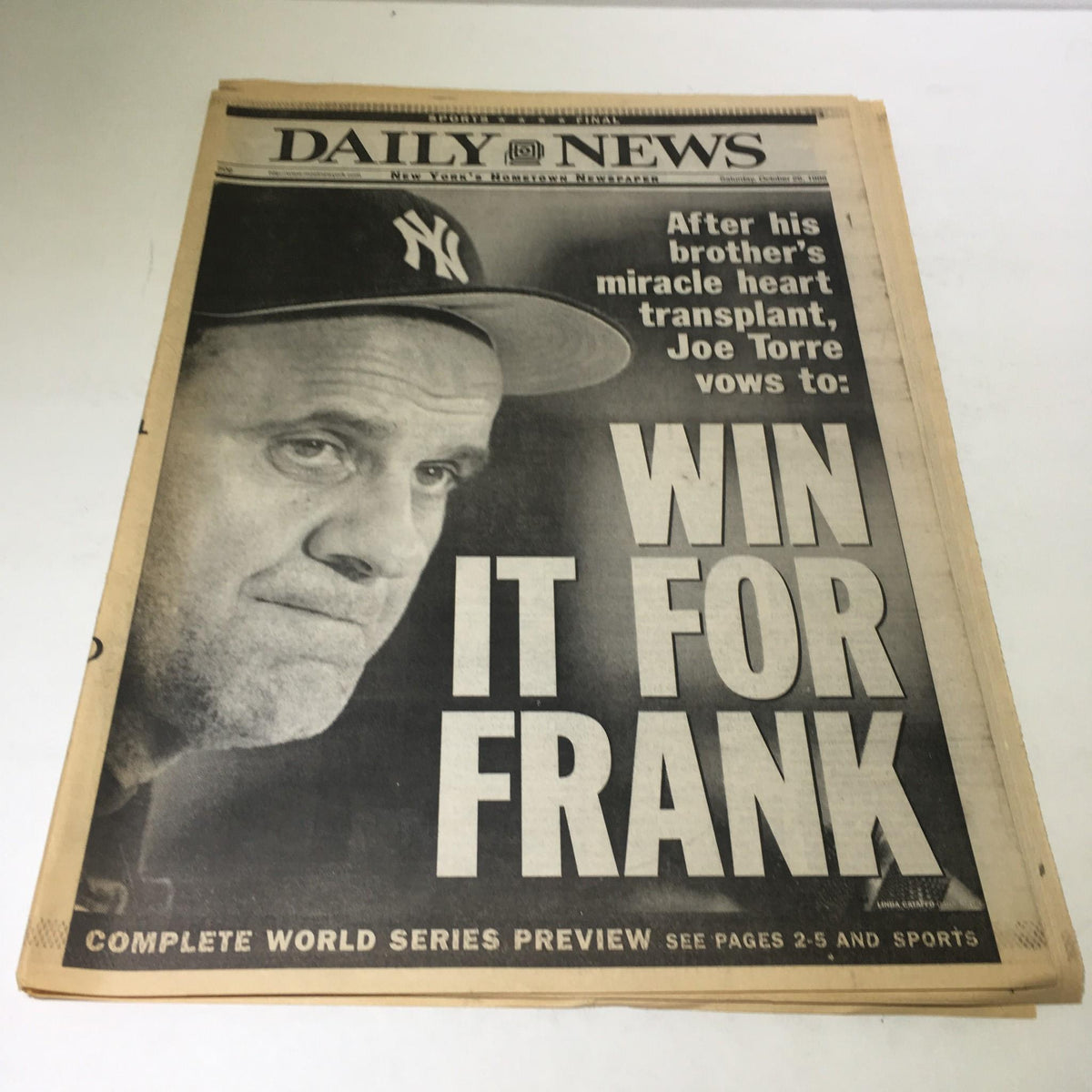 NY Daily News cover from October 26, 1996 featuring a portrait of Joe Torre with the headline 'WIN IT FOR FRANK' related to his brother's heart transplant.