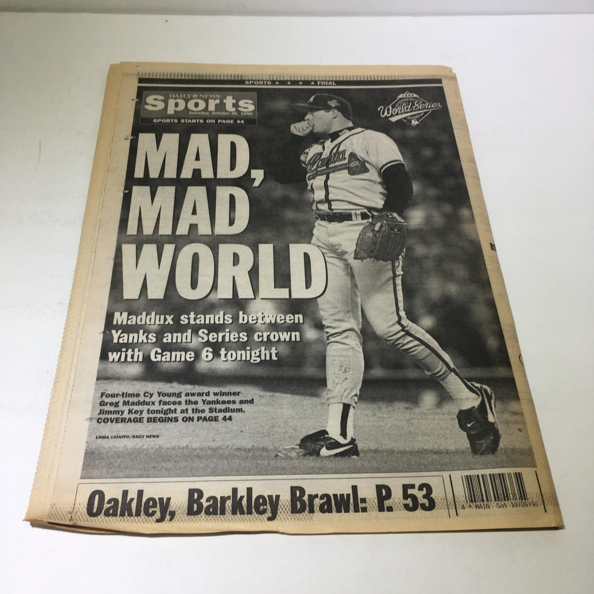 Back cover of NY Daily News Sports section featuring 'MAD, MAD WORLD', highlighting Greg Maddux and the upcoming Game 6 of the World Series.
