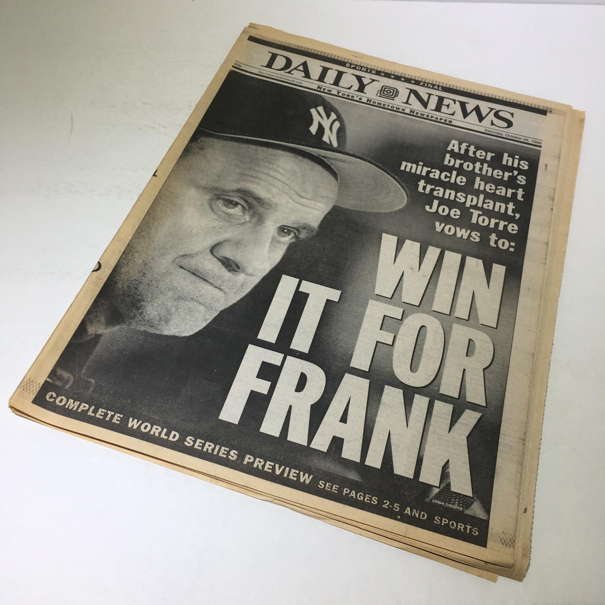 NY Daily News cover from October 26, 1996 displaying Joe Torre's promise to 'WIN IT FOR FRANK', emphasizing the dramatic moment in sports history.