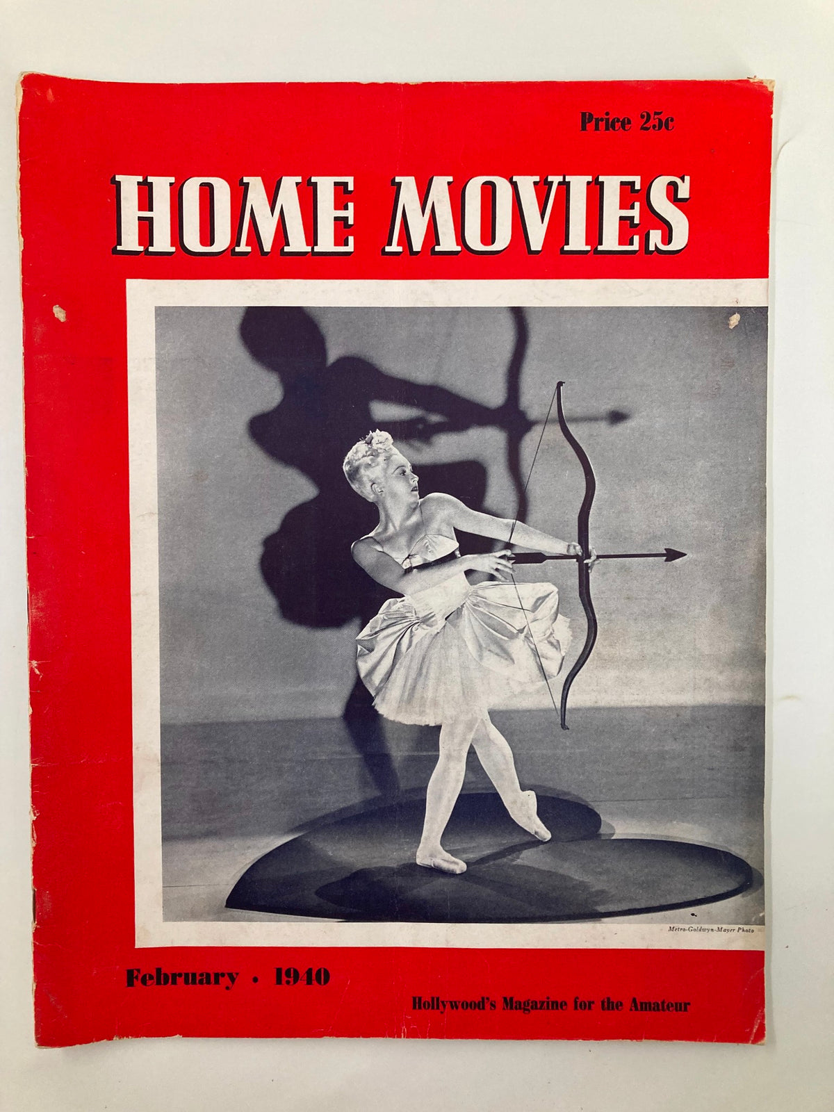 VTG Home Movies Magazine February 1940 featuring a vintage dancer on the cover with a red background and the title prominently displayed, perfect for collectors and film enthusiasts.
