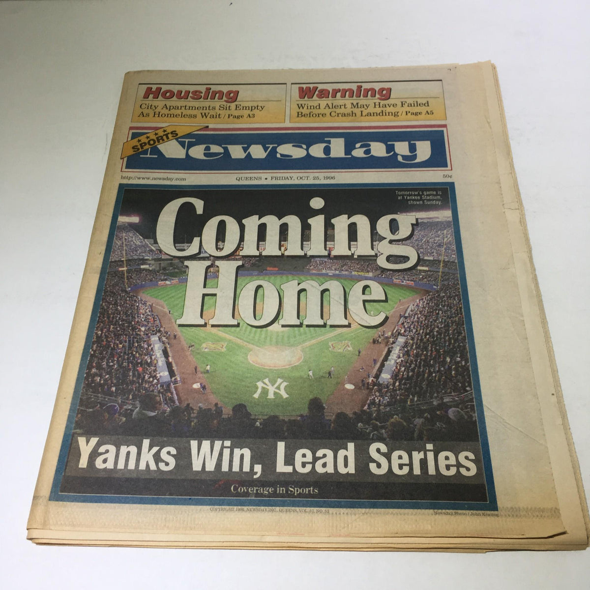 Newsday newspaper dated Oct 25, 1996 featuring the headline 'Coming Home, Yanks Win, Lead Series' with an image of a baseball stadium crowded with fans.
