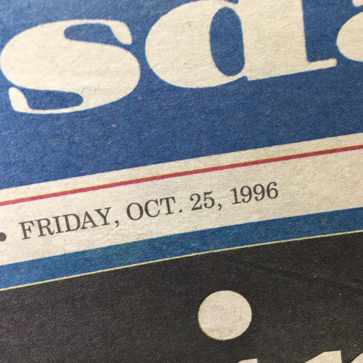 Close-up of Newsday newspaper highlighting the date 'Friday, Oct. 25, 1996' as part of the article 'Coming Home, Yanks Win, Lead Series'.