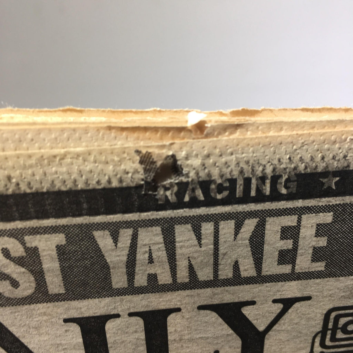 Close-up image showing the edge of the NY Daily News from October 14, 1996, with minor wear, emphasizing its vintage authenticity.
