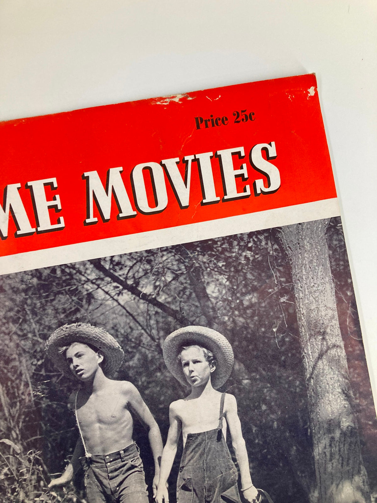 Cover of VTG Home Movies Magazine August 1940 featuring two boys in straw hats, with the price label visible. A study in composition reflecting vintage magazine charm.