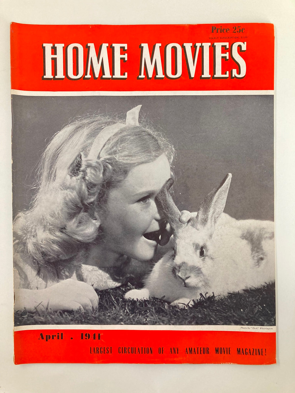 Cover page of VTG Home Movies Magazine April 1941 featuring a girl interacting with a rabbit, showcasing vintage home movie culture.