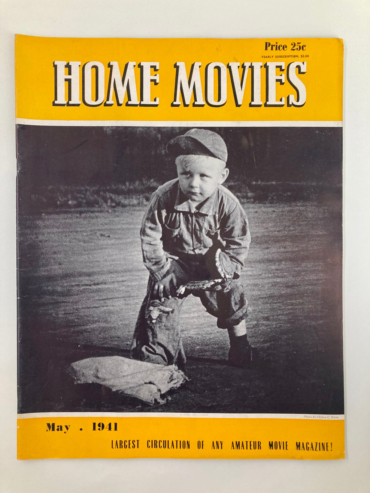 Cover of VTG Home Movies Magazine May 1941 featuring a young boy in vintage attire, showcasing the magazine's title 'HOME MOVIES' and price of 25 cents.