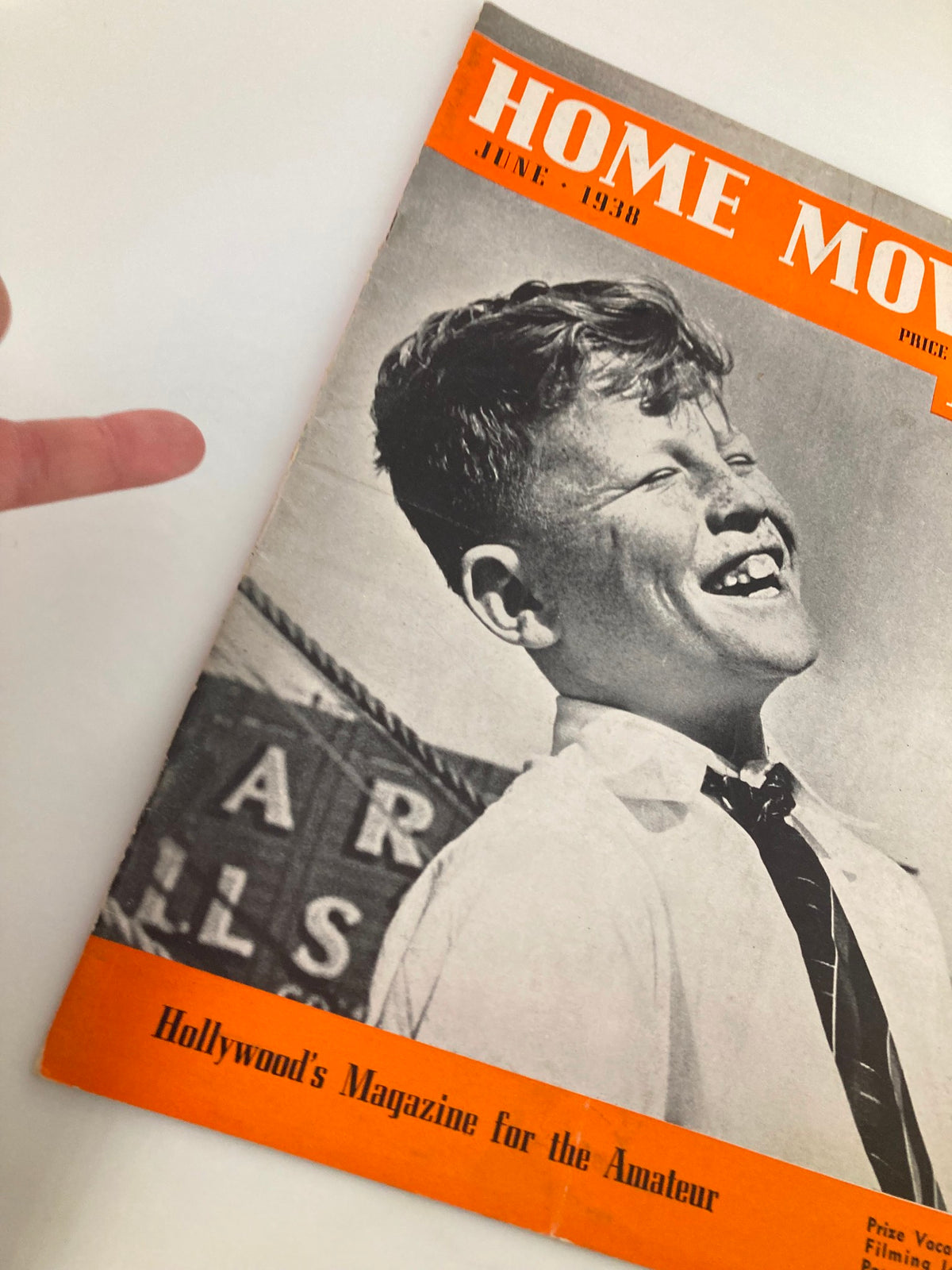 Cover of VTG Home Movies Magazine June 1938 featuring a smiling boy, representing a nostalgic piece of entertainment history.