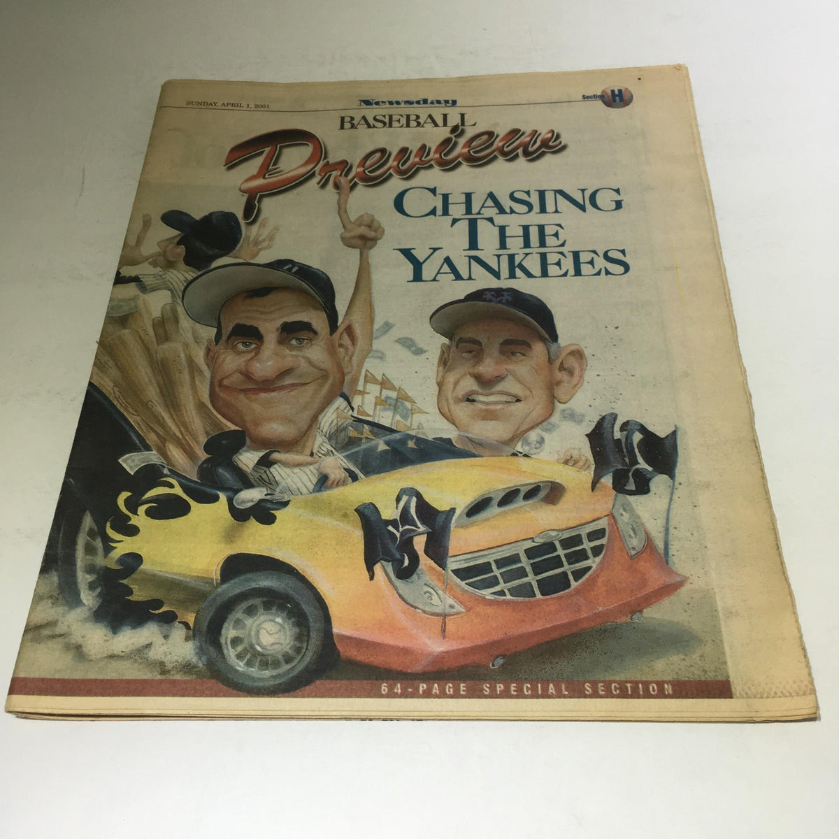 Close-up of Newsday: April 1 2001 Baseball Preview Chasing The Yankees cover, showcasing caricatures and a yellow car in a fun design.