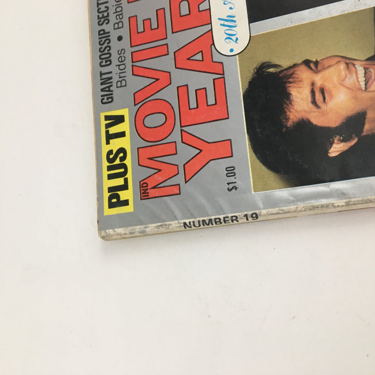 Side view of Movie Mirror Yearbook 1976 No. 19 showcasing its title and price, with a highlighted 20th anniversary sticker.