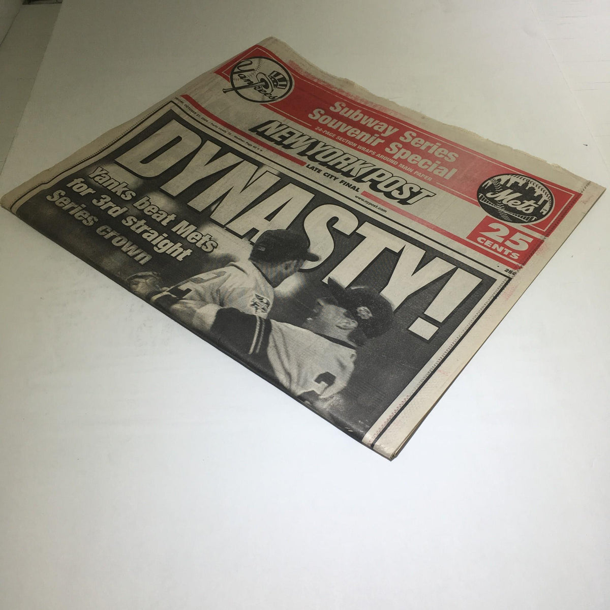 Cover of the New York Post from October 27, 2000, titled 'Dynasty! Yanks Beat Mets For 3rd Straight Series Down', featuring a memorable image celebrating the New York Yankees' World Series victory over the Mets.