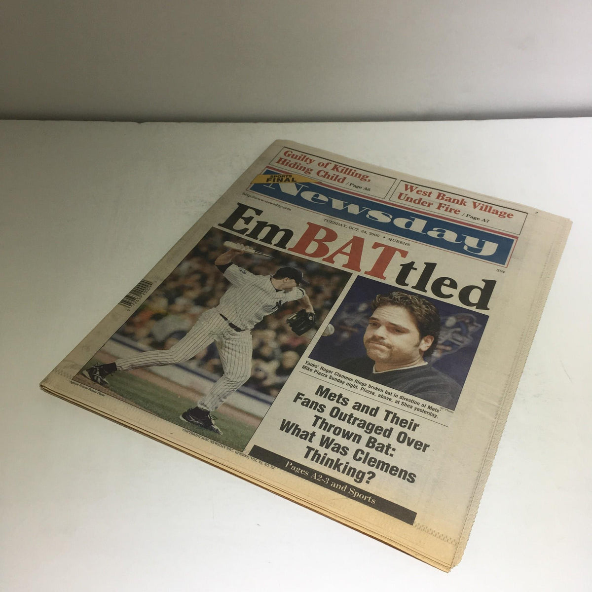 Another view of the front page of Newsday, titled 'EmBATtled,' featuring images related to the Mets and Yankees, emphasizing the controversy of the thrown bat incident.